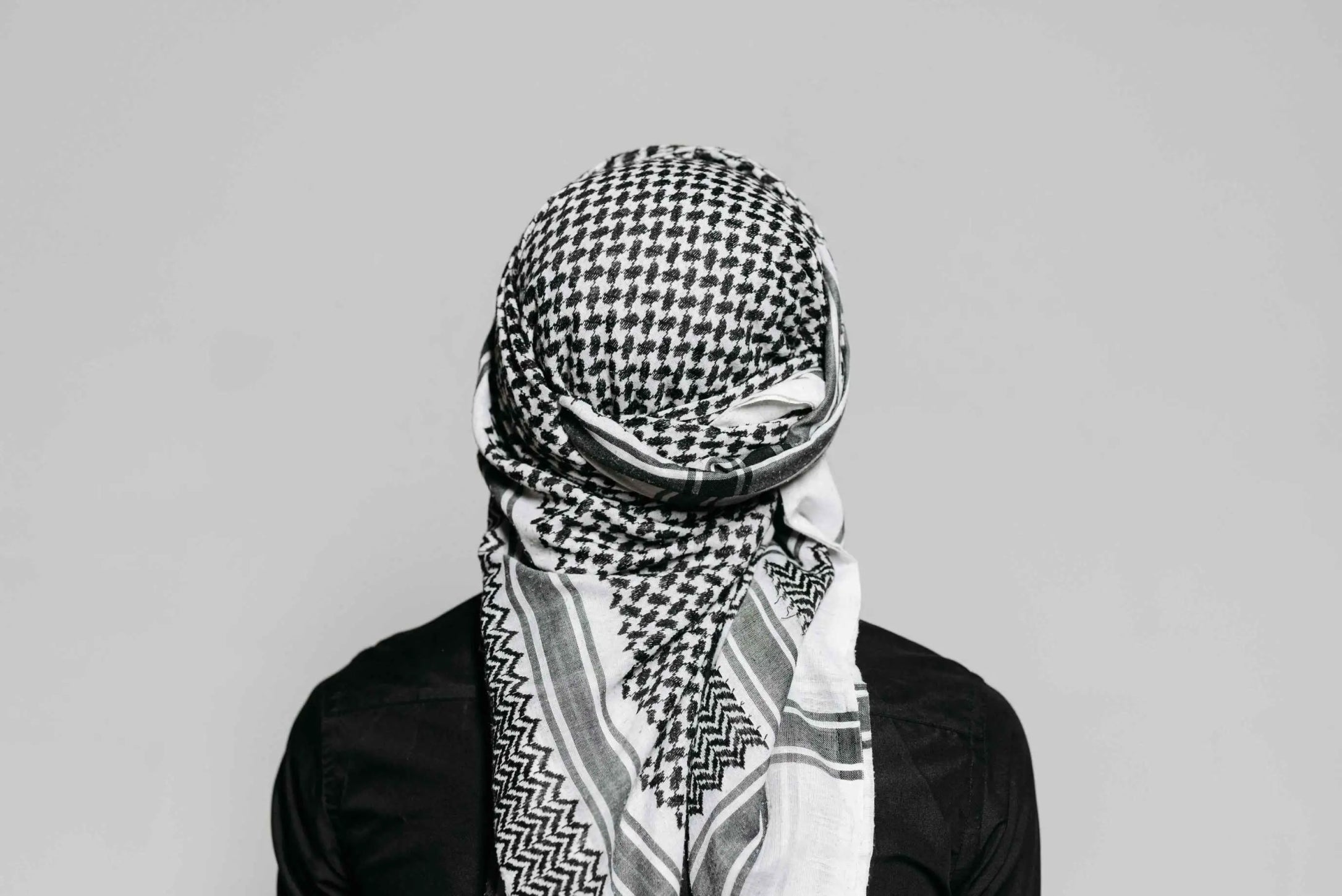 Premium Palestinian Keffiyeh in classic black and white design - Available at Kufiya Corner.